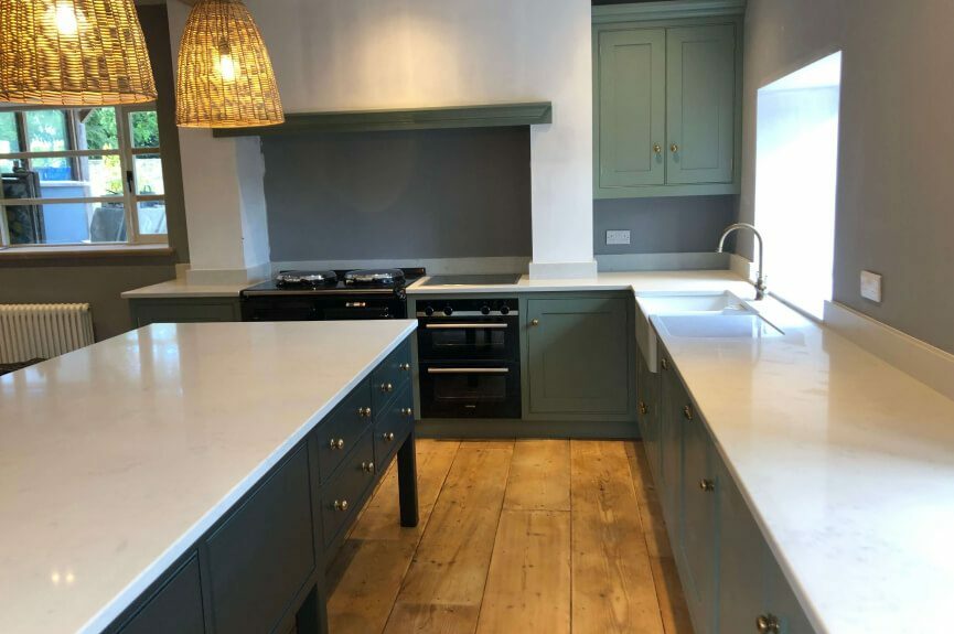 bespoke green kitchen with quarts countertop